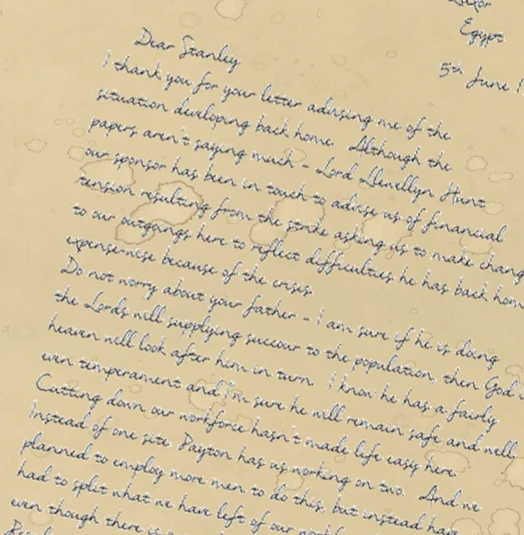 A handwritten letter on aged paper, with loops in the handwriting picking out a hidden message