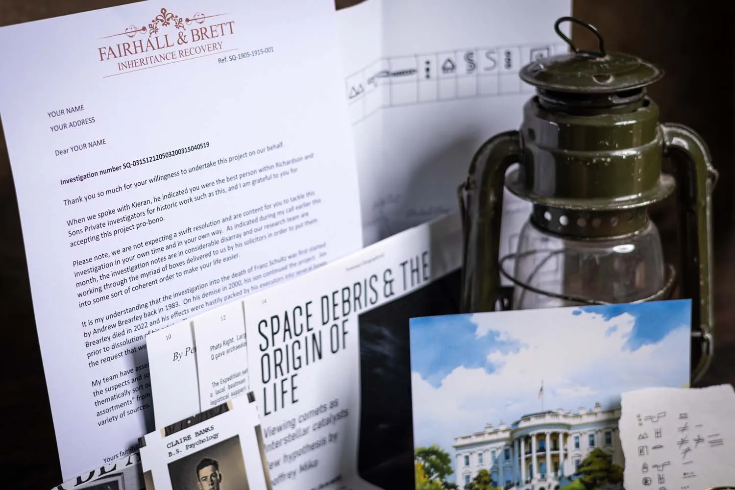 The Site Q case file — a Mayan cipher paper, a White House postcard and portrait cards — laid out for a recipient