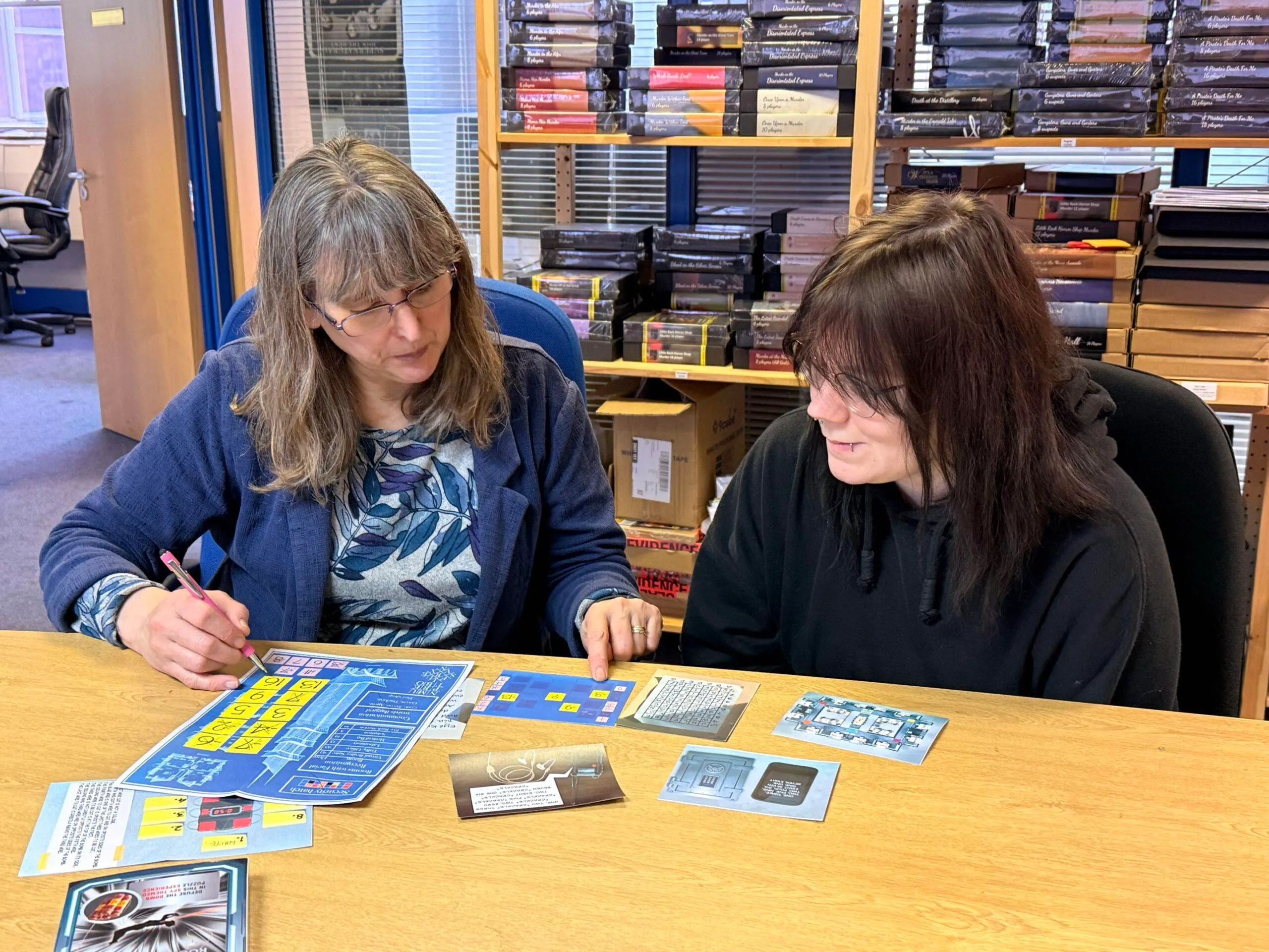 Two players solving the Mission Rogue Protocol puzzle box