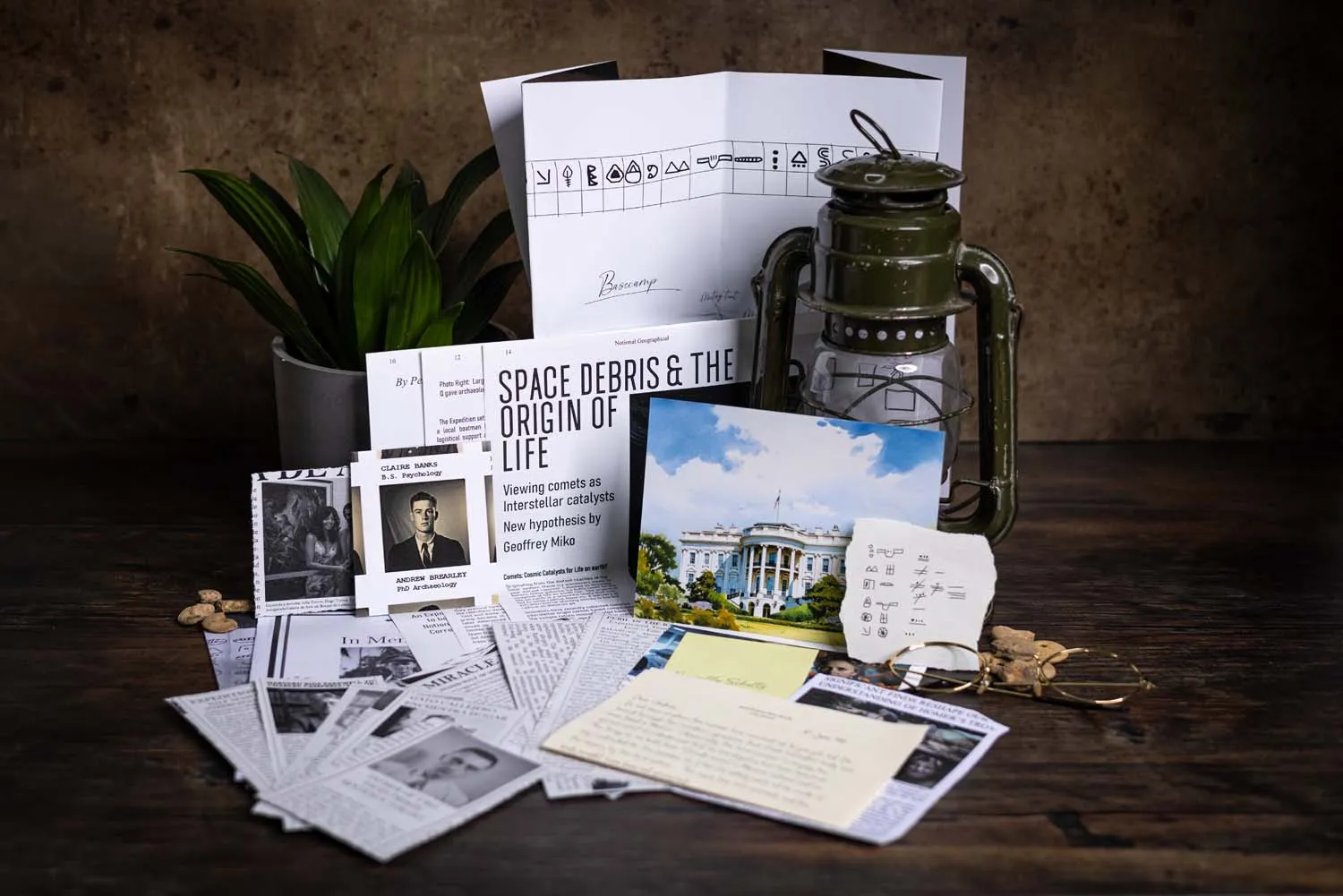 A Cosykiller case file spread out across a dark wooden desk — magazine article, hurricane lamp, Mayan glyphs